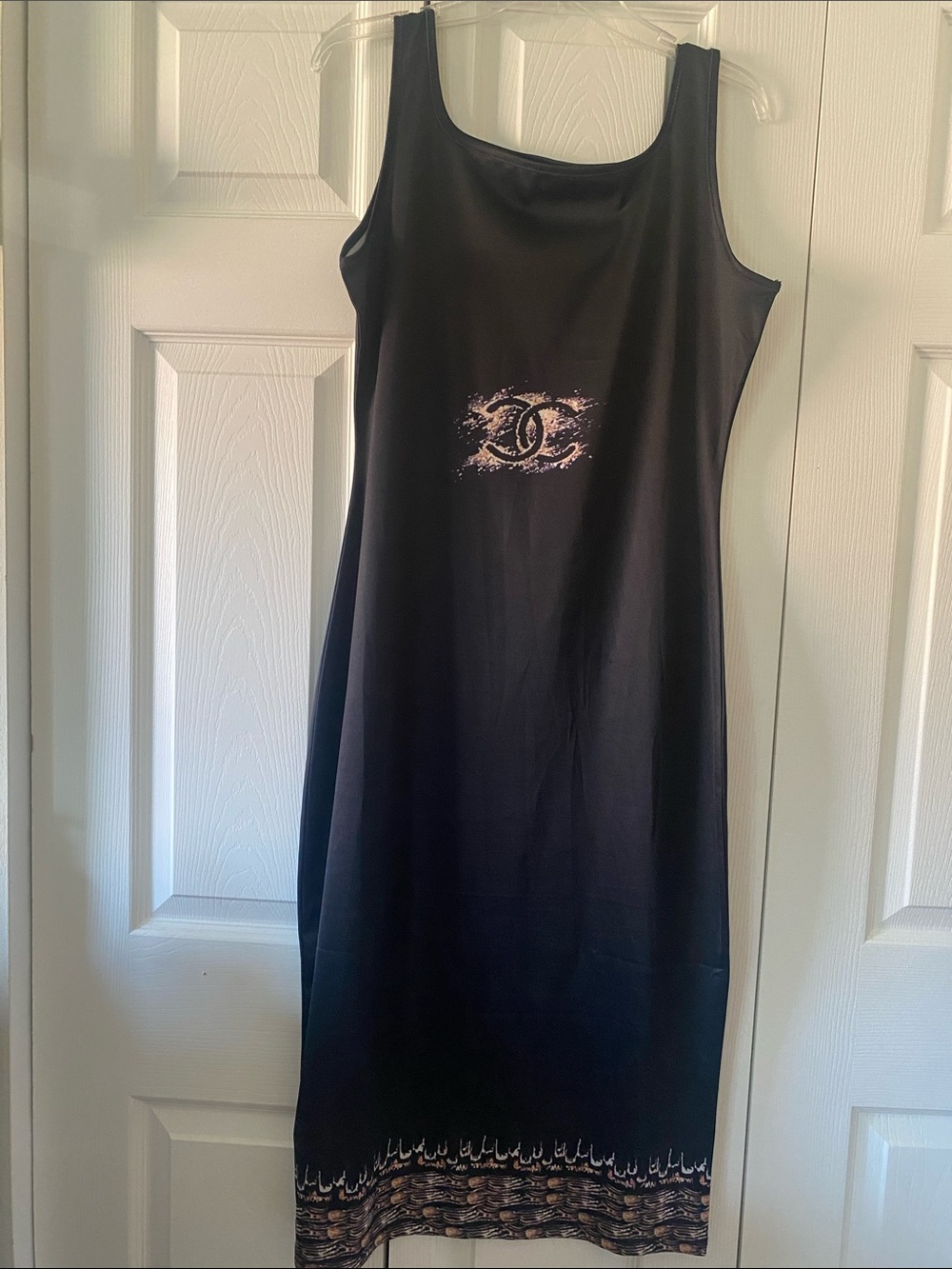 Source Unknown Black Maxi Dress with Center Emblem and Decorative Hem